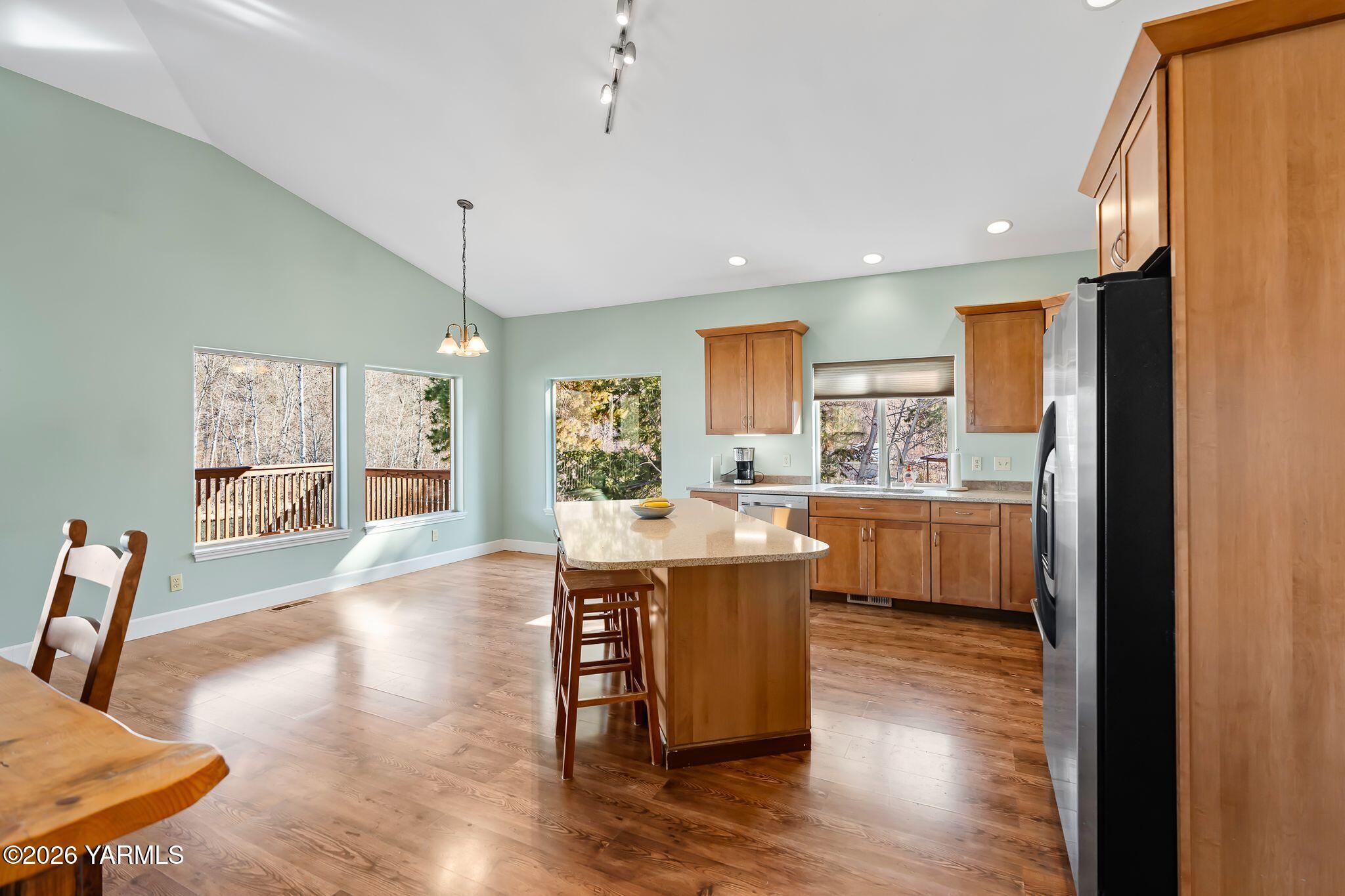1575 Nile Road Naches, WA 98937 - Photo 14 of 51 a view of a dining room with furniture a chandelier and wooden floor