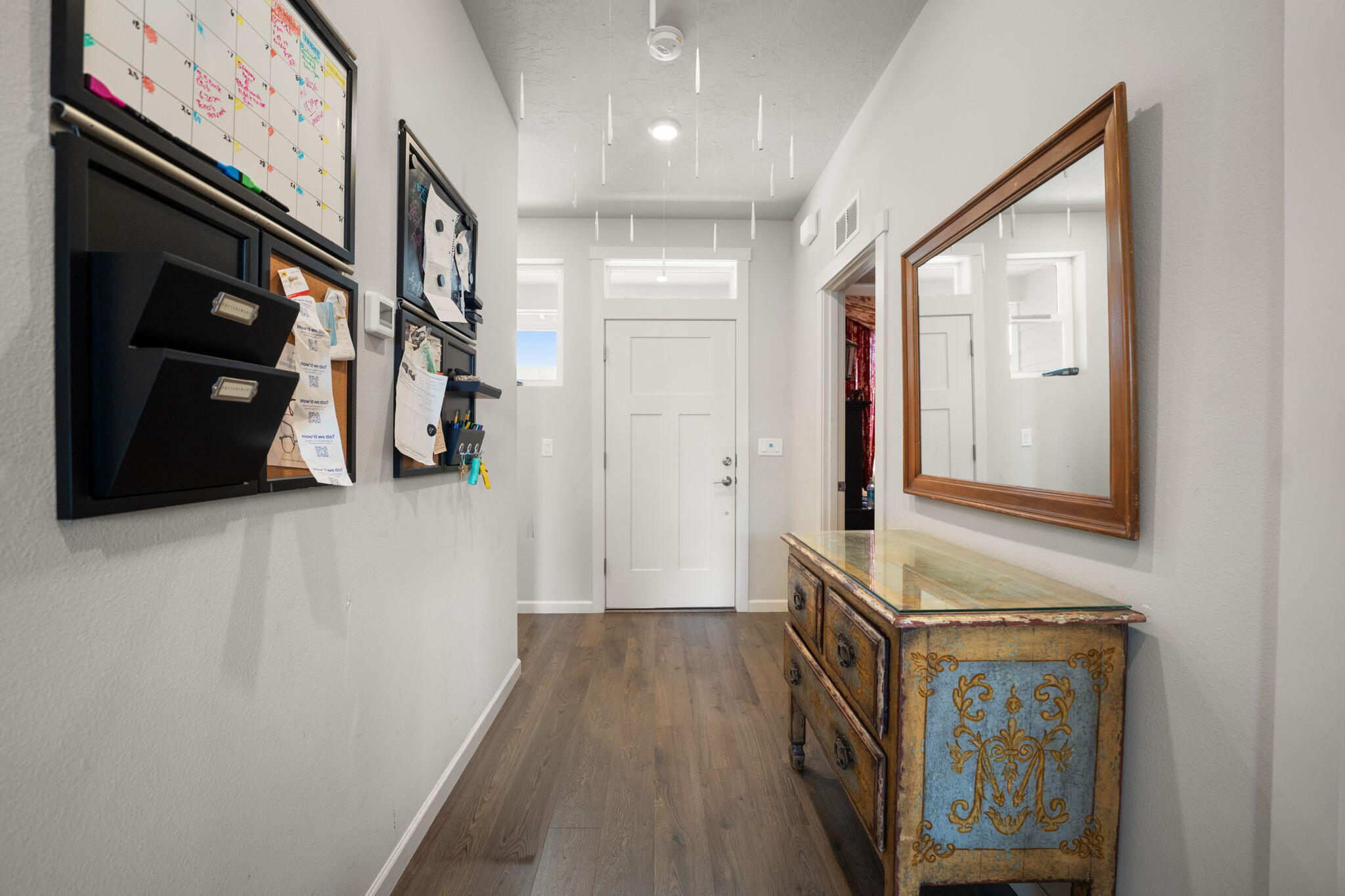 4039 Southwest Quartz Place Redmond, OR 97756 - Photo 6 of 44 a view of a hallway with wooden floor and staircase