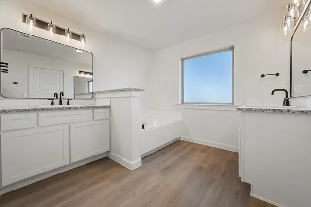 a bathroom with a sink and mirror