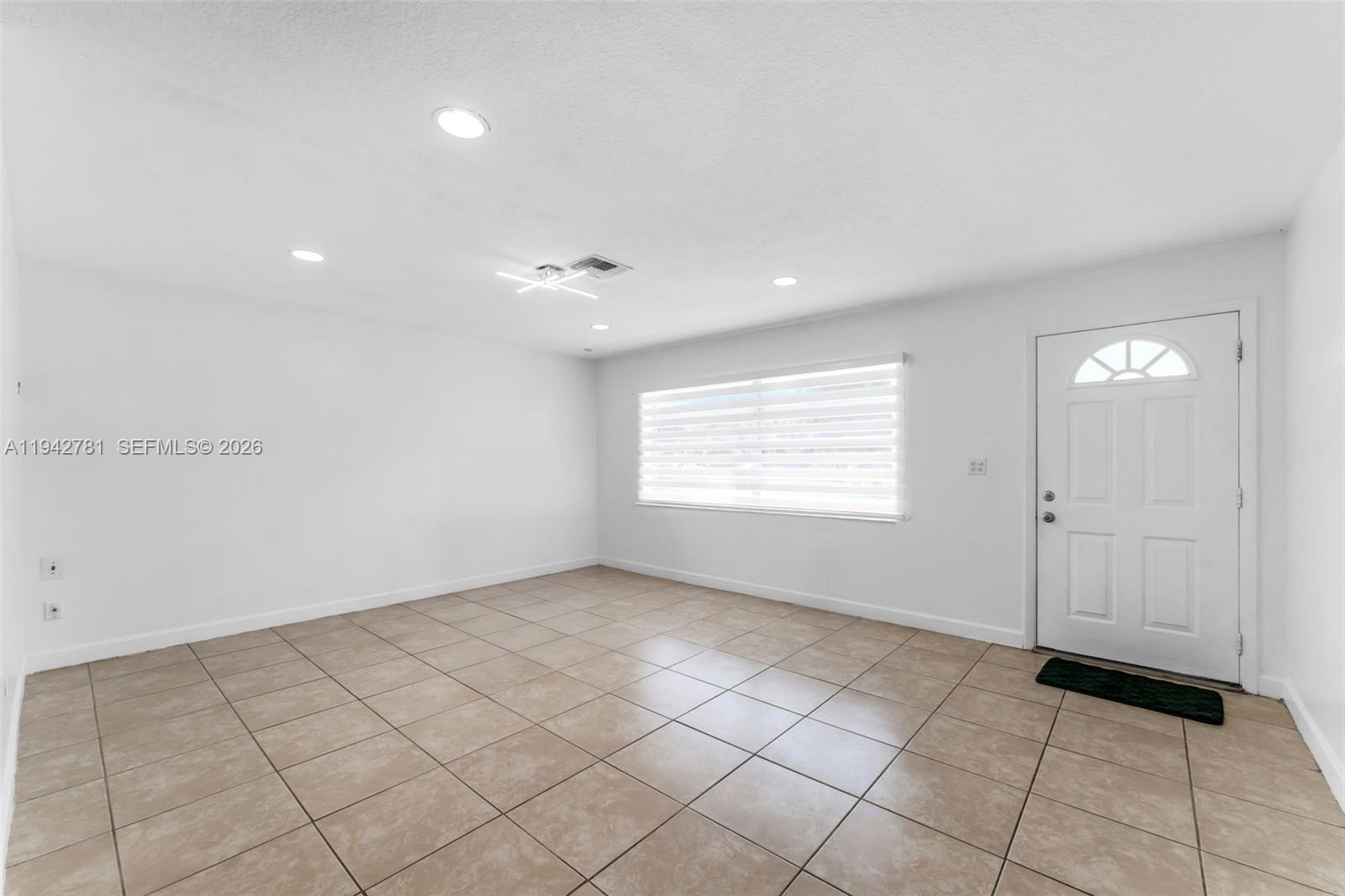15805 Southwest 300th Terrace Homestead, FL 33033 - Photo 13 of 52 a view of an empty room and a window