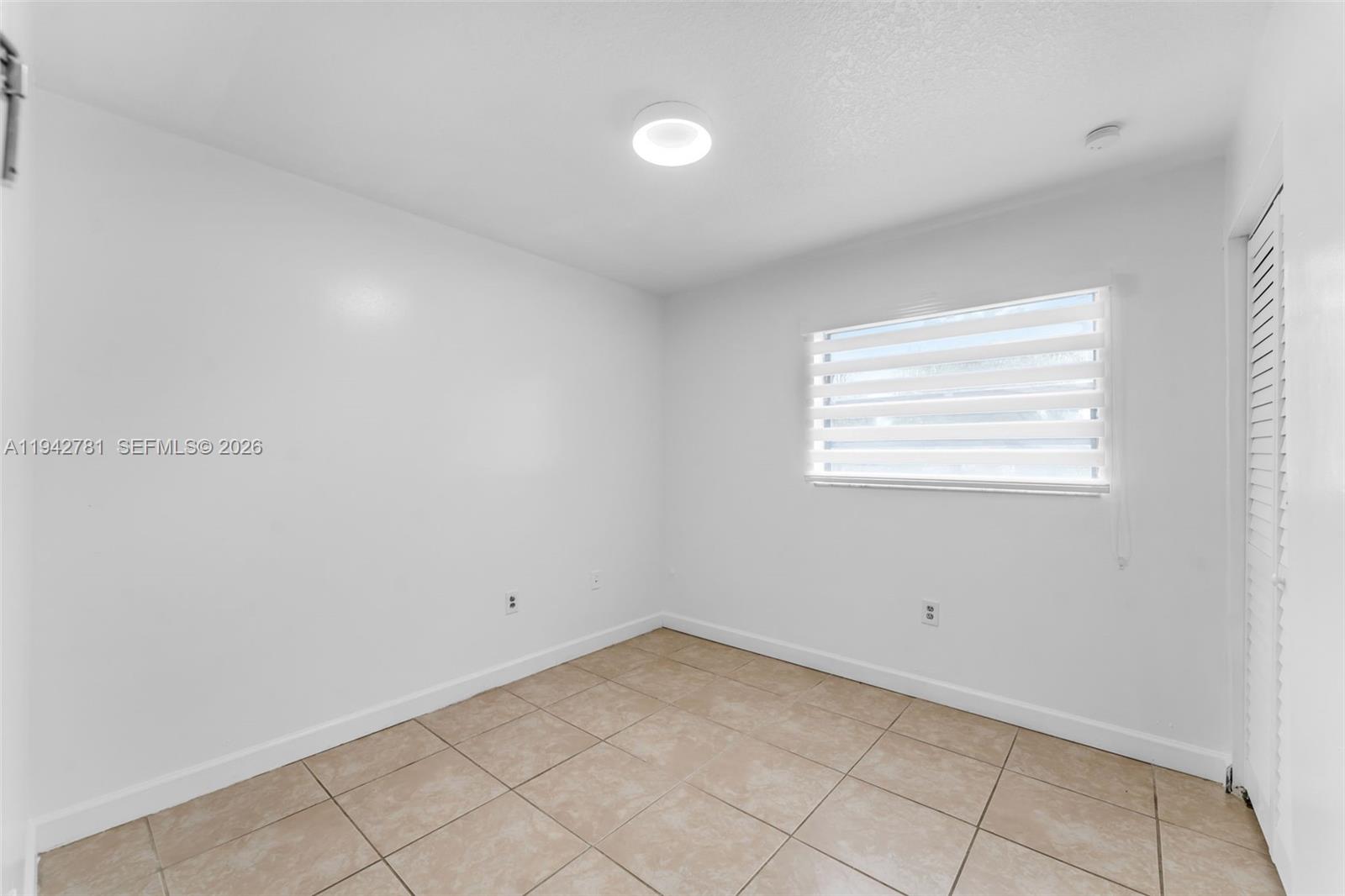 15805 Southwest 300th Terrace Homestead, FL 33033 - Photo 21 of 52 a view of a room that has a window in it