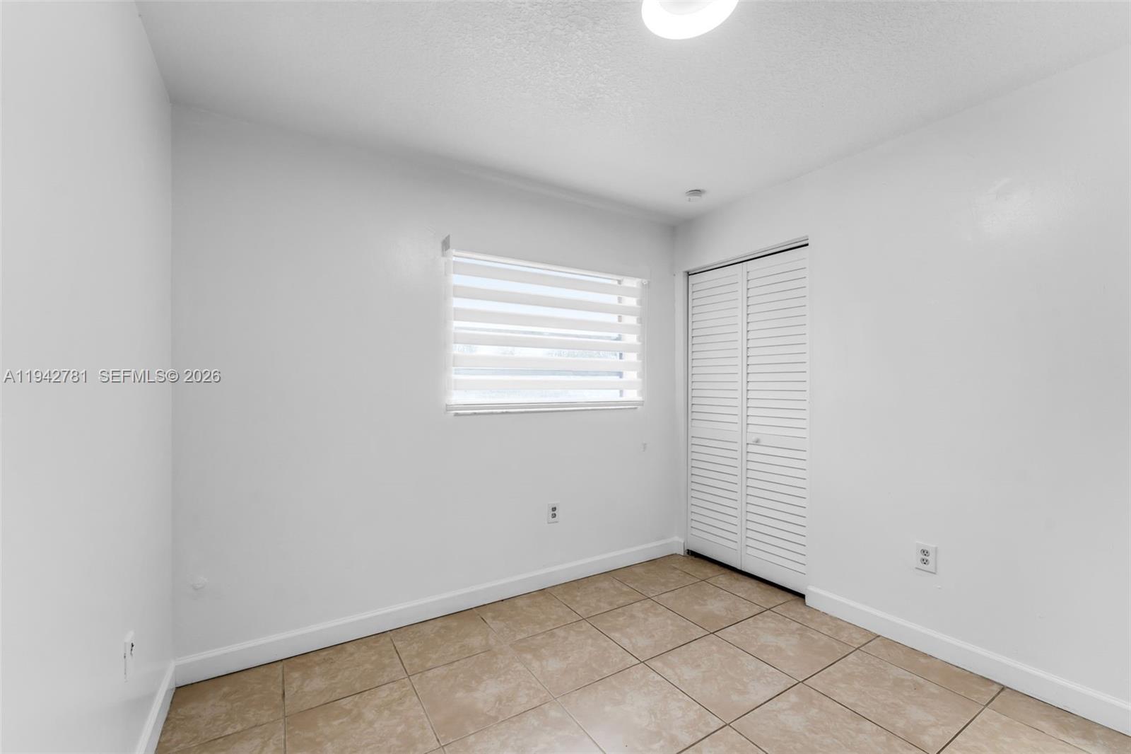 15805 Southwest 300th Terrace Homestead, FL 33033 - Photo 22 of 52 a view of a room that has a window in it
