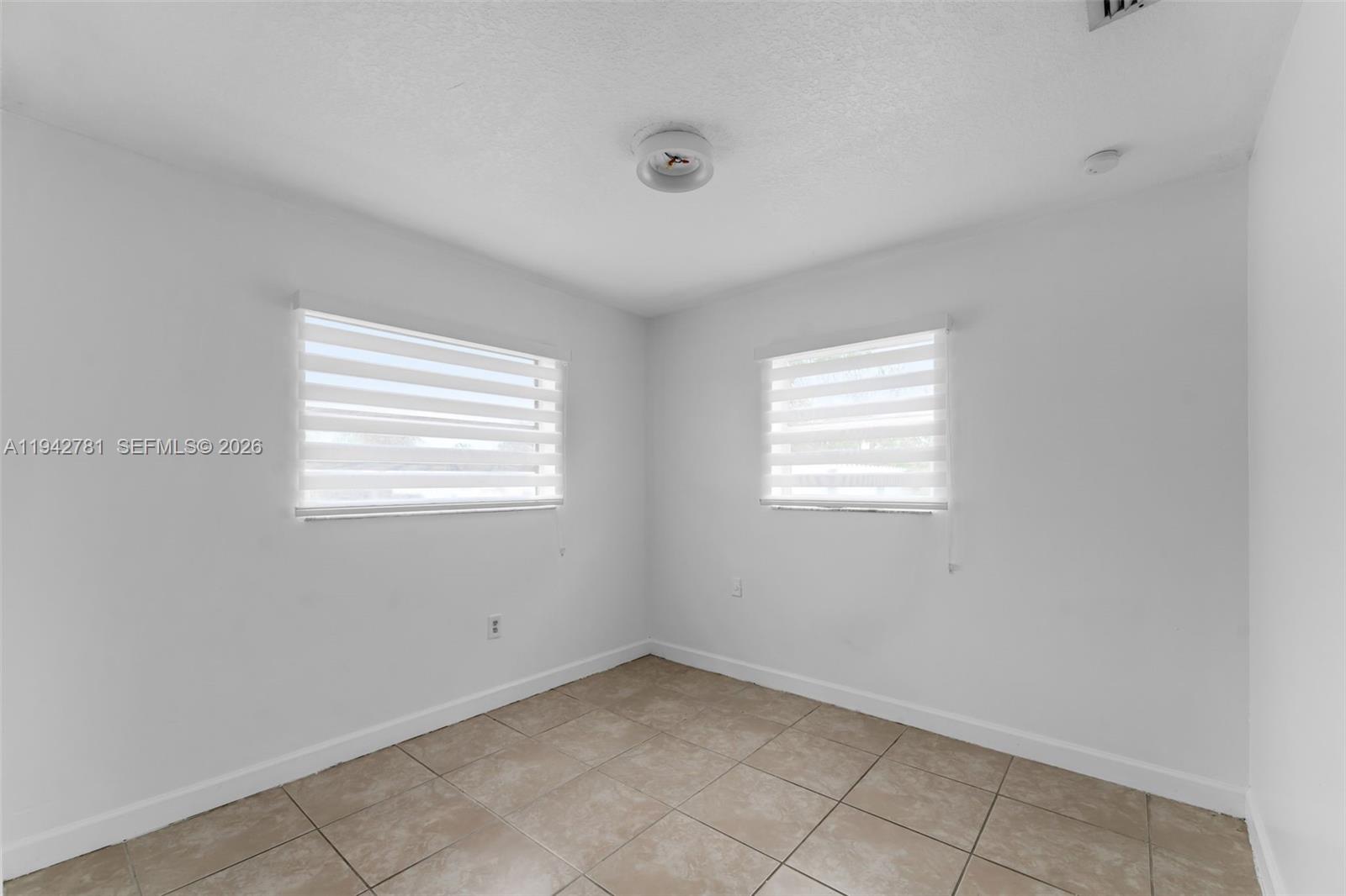 15805 Southwest 300th Terrace Homestead, FL 33033 - Photo 23 of 52 a view of an empty room with a window