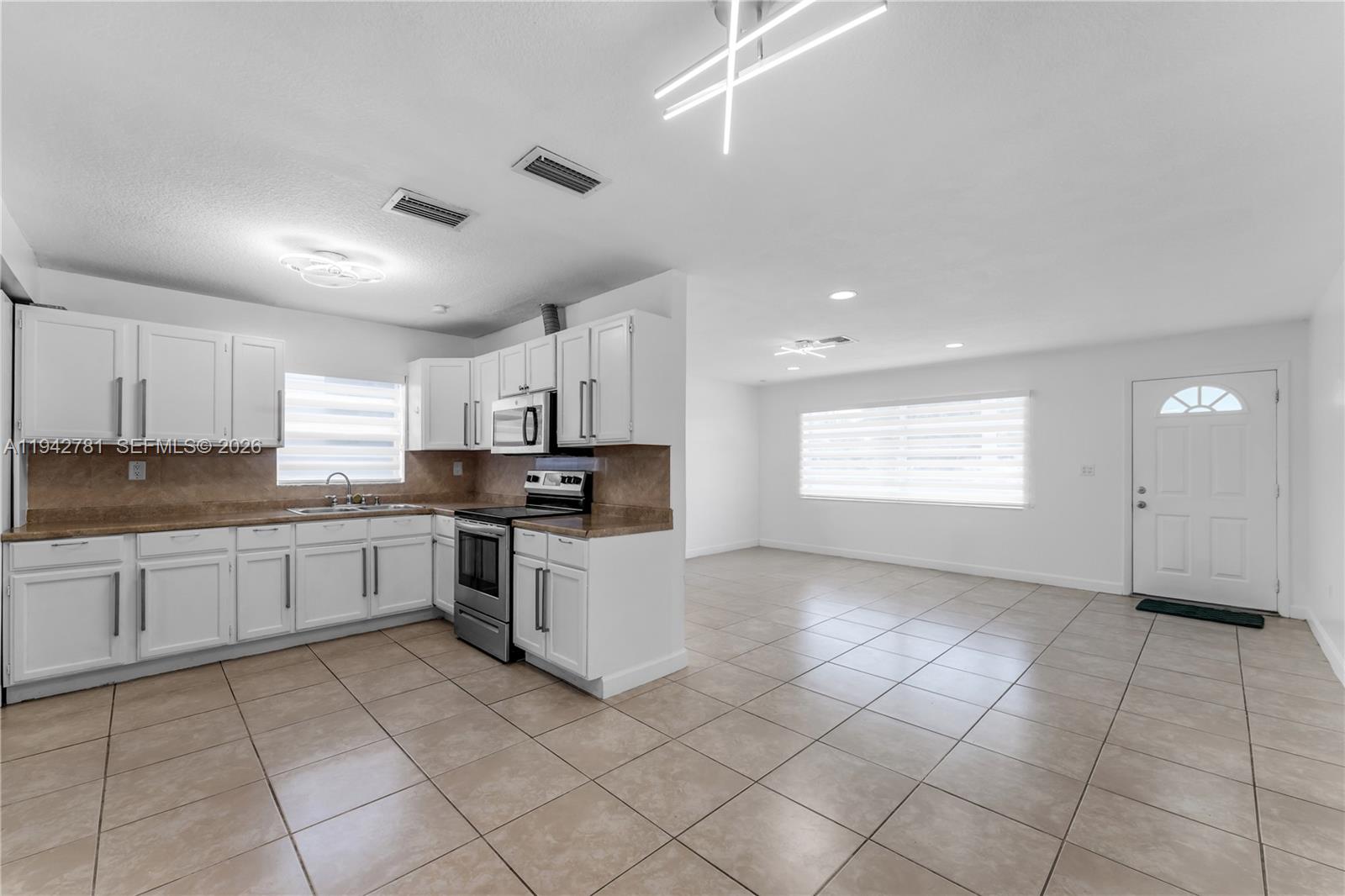 15805 Southwest 300th Terrace Homestead, FL 33033 - Photo 41 of 52 a large white kitchen with cabinets