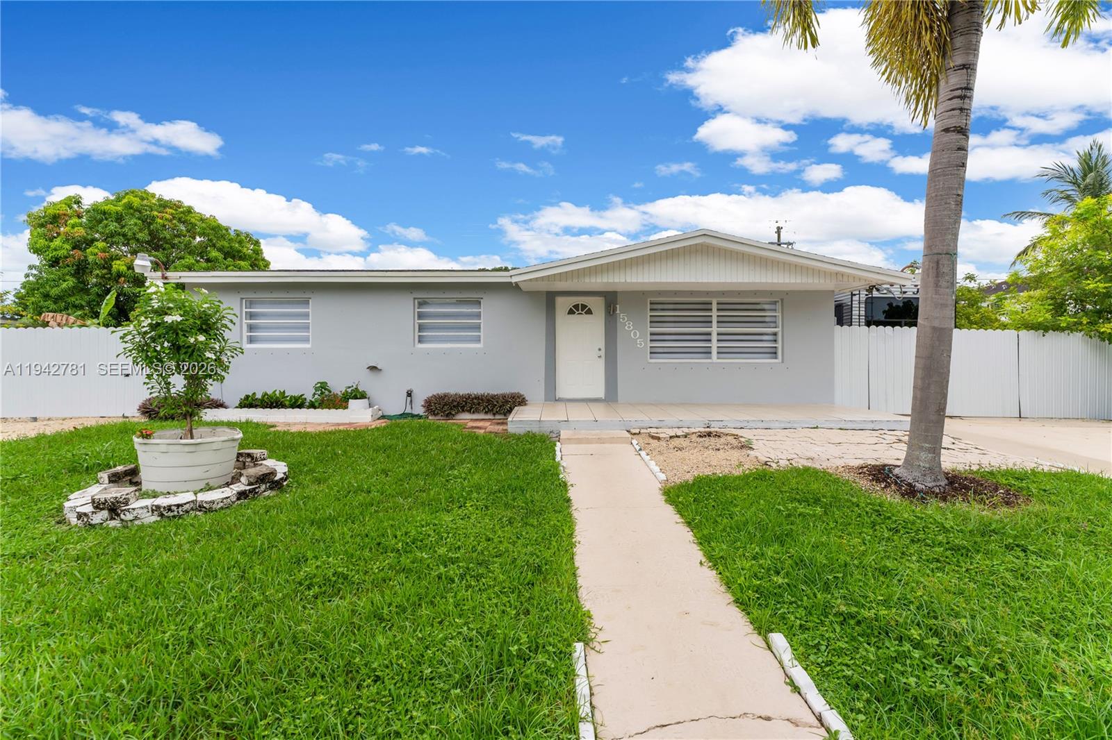 15805 Southwest 300th Terrace Homestead, FL 33033 - Photo 50 of 52 a front view of house with yard and green space