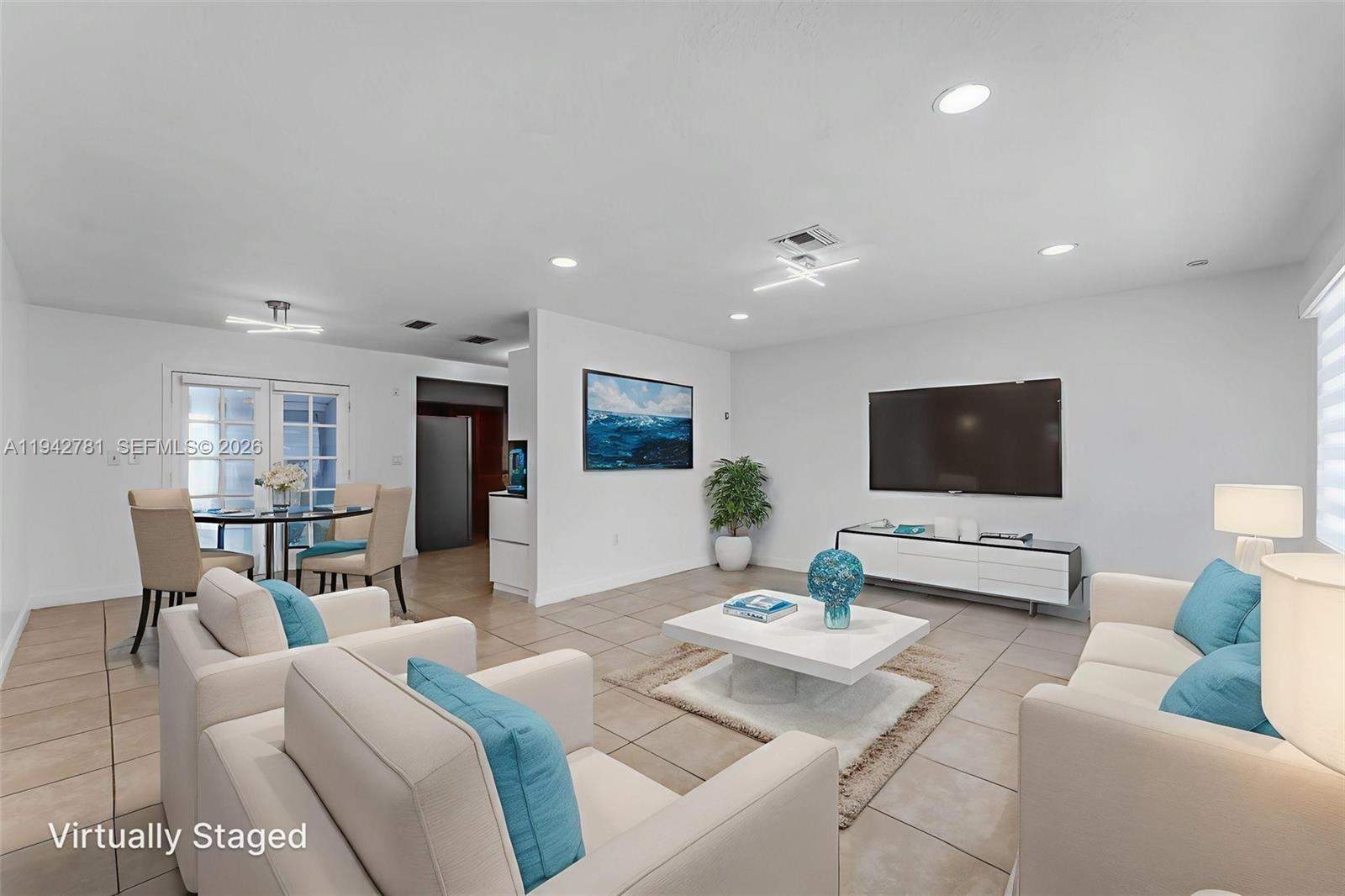 15805 Southwest 300th Terrace Homestead, FL 33033 - Photo 5 of 52 a living room with furniture and a flat screen tv