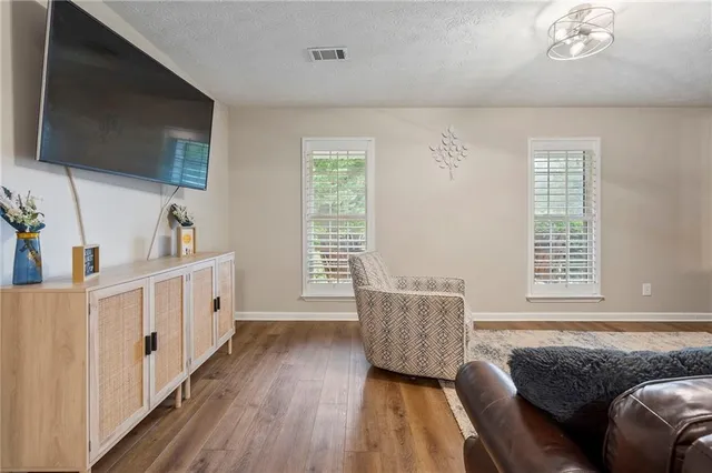 a view of a dining room with furniture and wooden floor
