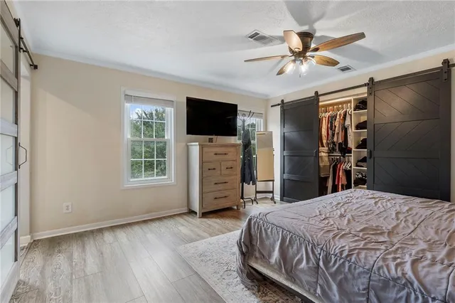 a bedroom with a bed and a table in it