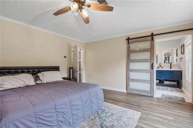 a bedroom with a bed and a couch