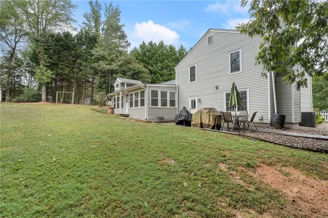a view of a door and chair in the balcony