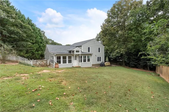 an aerial view of a house with swimming pool