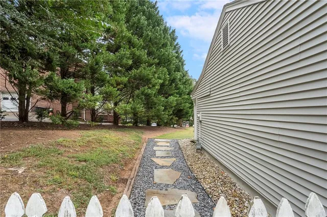 an aerial view of a house with a garden