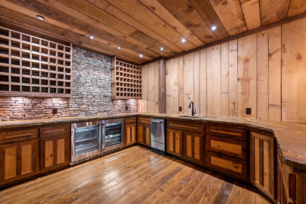 2100 Big Creek Road Cherry Log, GA 30522 - Photo 44 of 148 a kitchen with stainless steel appliances granite countertop wooden cabinets a sink and dishwasher a stove with wooden floor