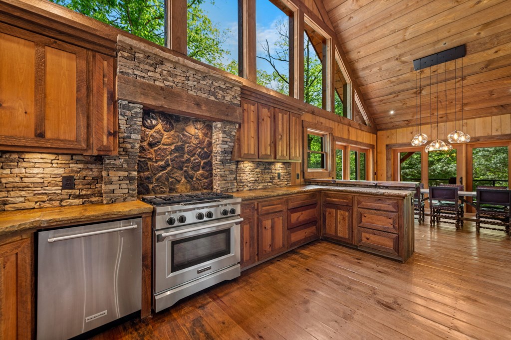 2100 Big Creek Road Cherry Log, GA 30522 - Photo 7 of 148 a kitchen with stainless steel appliances granite countertop a stove and a sink