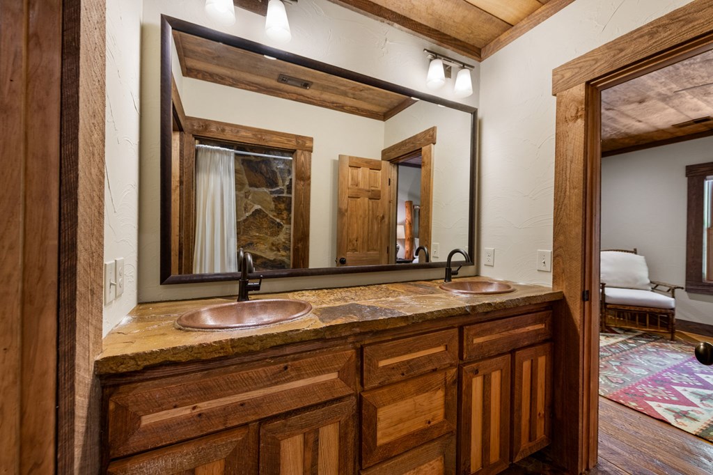 2100 Big Creek Road Cherry Log, GA 30522 - Photo 90 of 148 a bathroom with a granite countertop sink and a mirror