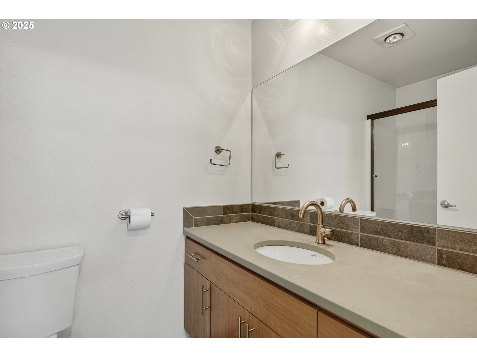 8083 North Leavitt Avenue Portland, OR 97203 - Photo 26 of 34 a bathroom with a sink and a mirror