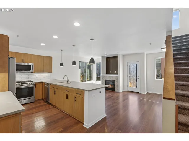 a kitchen with a stove and a refrigerator
