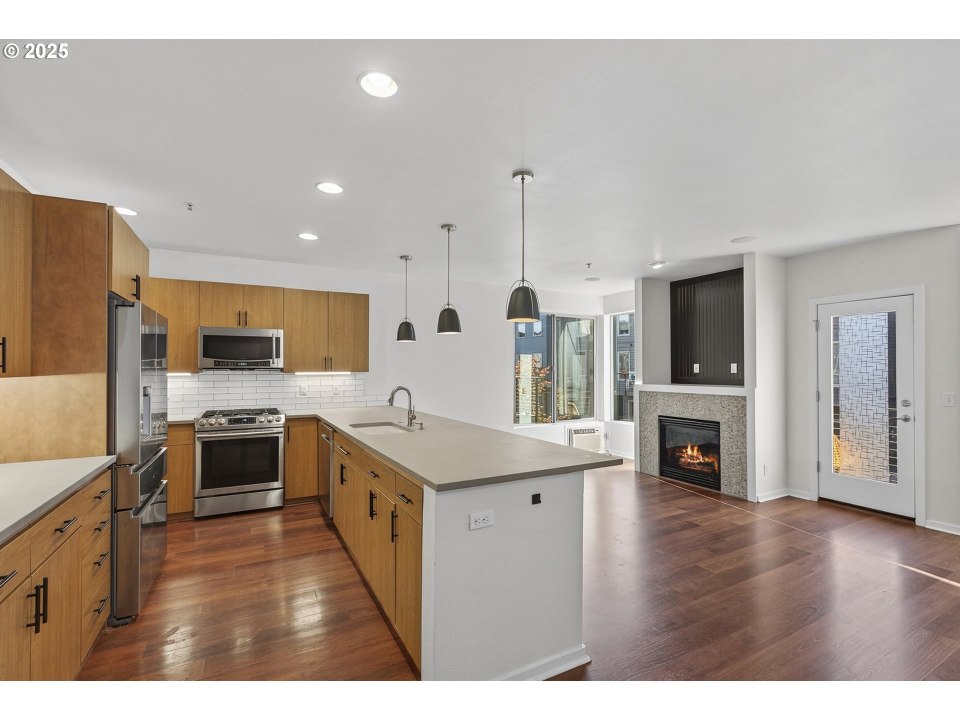 8083 North Leavitt Avenue Portland, OR 97203 - Photo 6 of 34 a kitchen with stainless steel appliances granite countertop a stove top oven a sink and a refrigerator