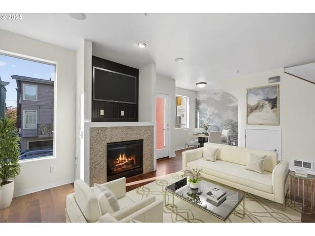 a living room with furniture and a fireplace