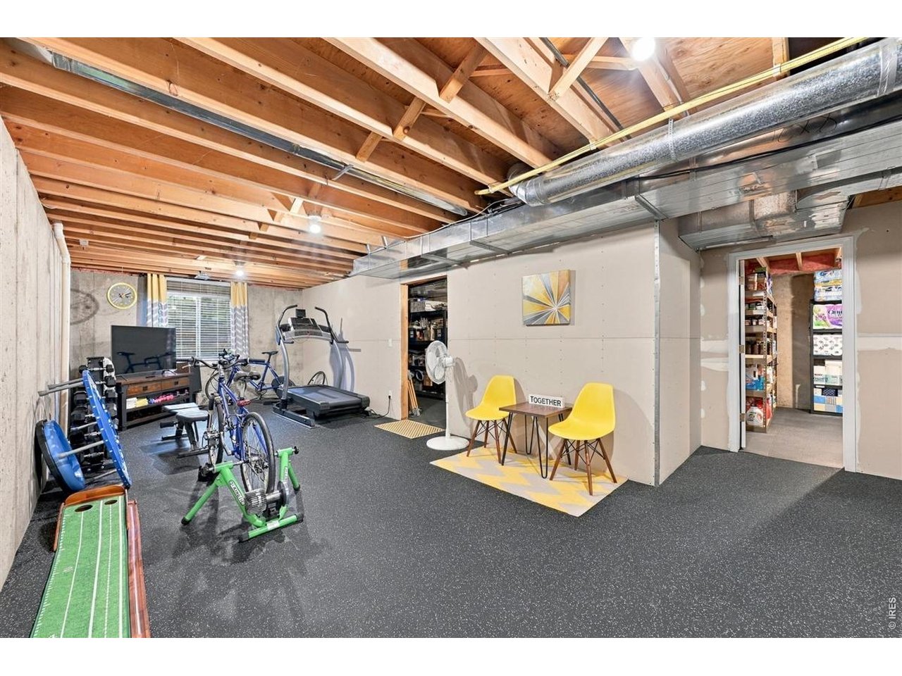 3754 Kentford Road Fort Collins, CO 80525 - Photo 39 of 50 Versatile exercise and recreation space with rubber gym flooring & flexible space for recreation or future finishing