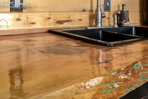 a kitchen with a sink and a window