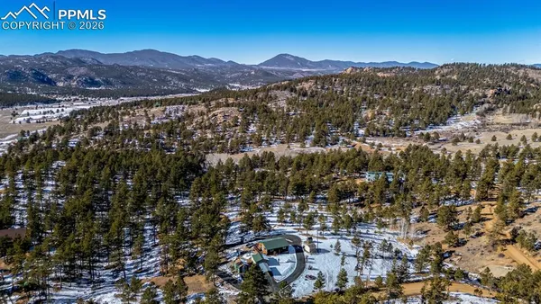 a view of a city with mountains in the background