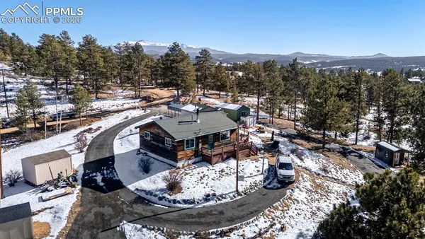 a view of a terrace with a sink and a mountain view
