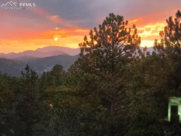 a view of a house with a mountain in the background