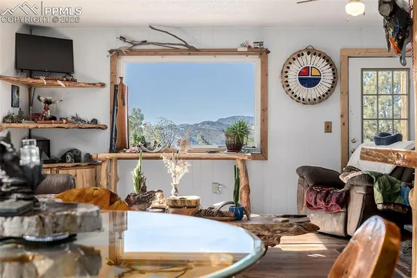 a room with furniture and a flat screen tv