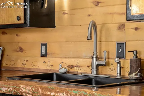 a bathroom with a sink and mirror