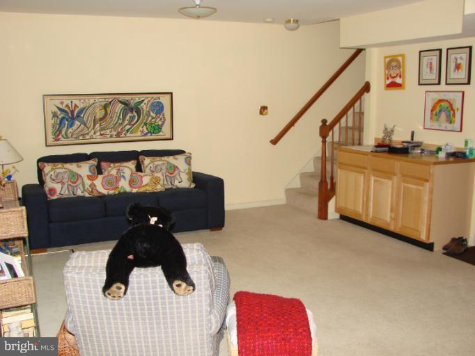 2205 Bear Den Road Frederick, MD 21701 - Photo 2 of 19 a bedroom with furniture and a wooden floor