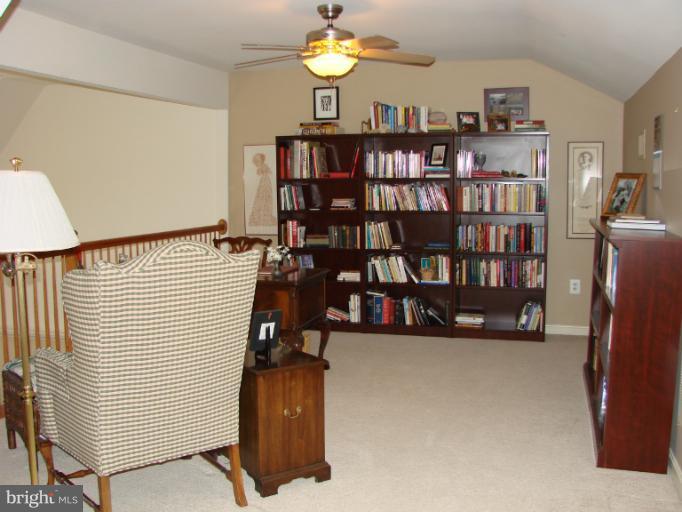 2205 Bear Den Road Frederick, MD 21701 - Photo 16 of 19 a view of a book shelf with a couch