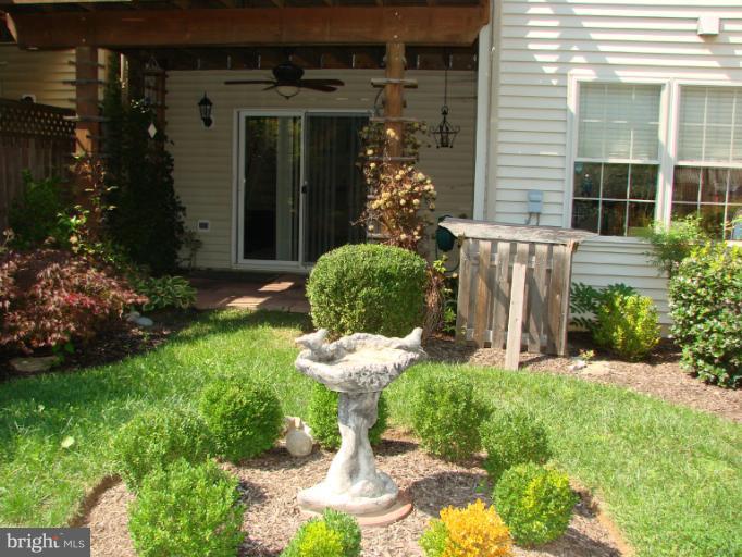 2205 Bear Den Road Frederick, MD 21701 - Photo 19 of 19 a view of a small house with a yard and potted plants
