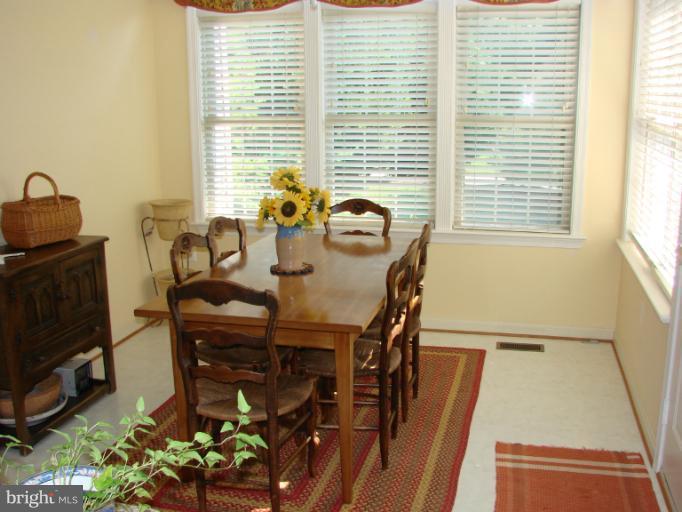2205 Bear Den Road Frederick, MD 21701 - Photo 5 of 19 a view of a dining room with furniture and a window