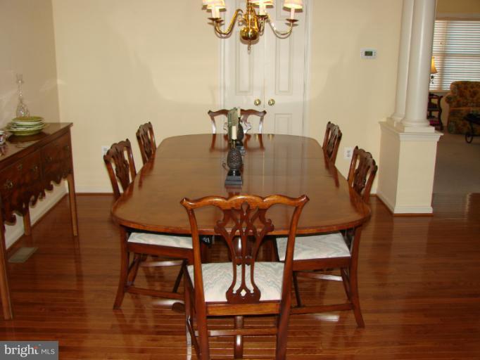 2205 Bear Den Road Frederick, MD 21701 - Photo 10 of 19 a view of a dining room with furniture and wooden floor