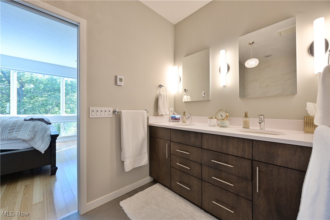 18875 Riversouth Fairview Park, Unit 30 Cleveland, OH 44126 - Photo 19 of 39 Ensuite bathroom with double vanity and baseboards