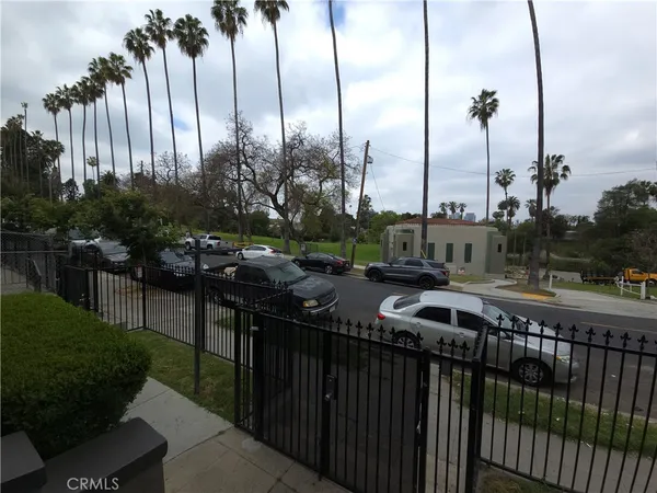 a city view with a space and trees in the background