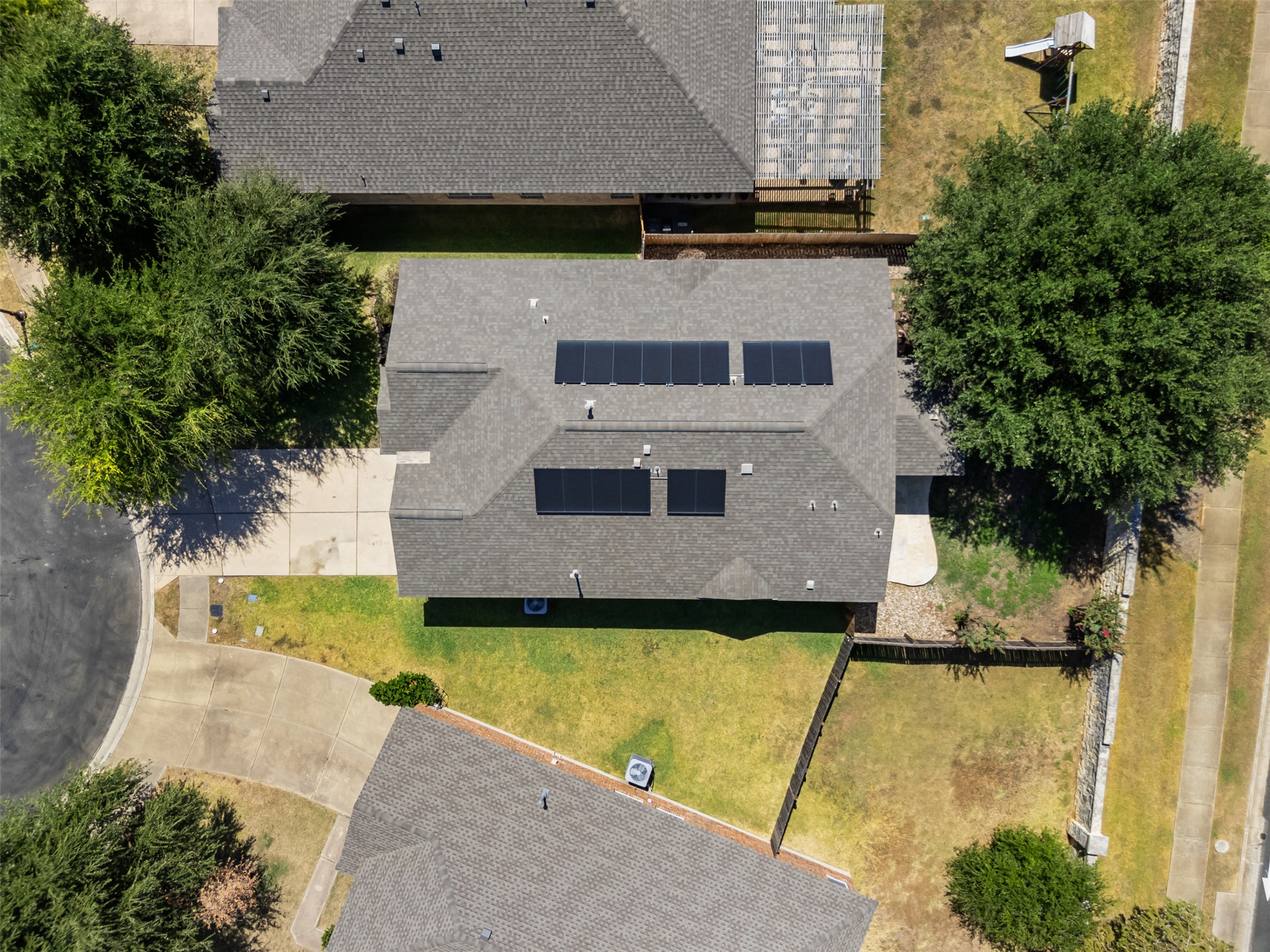 14316 Marathon Road Austin, TX 78717 - Photo 36 of 40 An aerial perspective showcases the shingle roof complete with integrated solar panels.