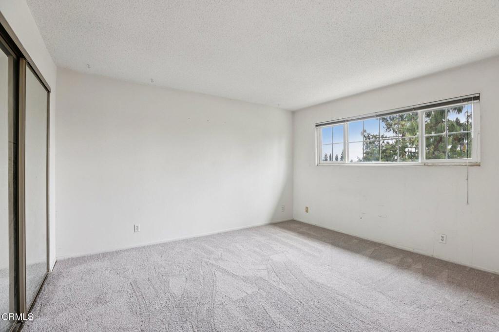 10856 Topeka Drive Porter Ranch, CA 91326 - Photo 21 of 39 a view of an empty room with a window