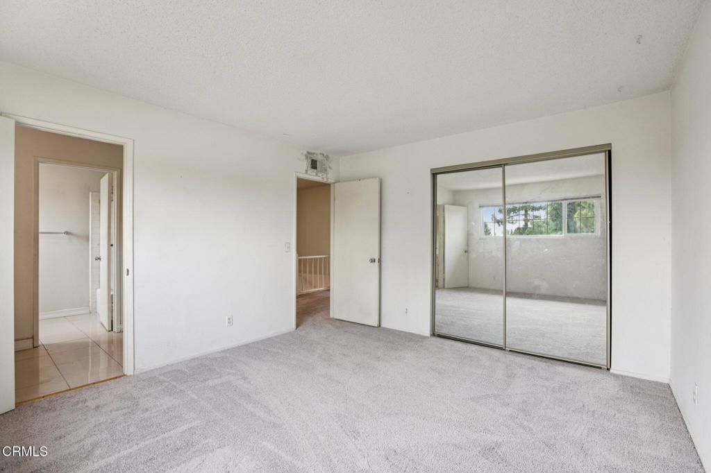 10856 Topeka Drive Porter Ranch, CA 91326 - Photo 23 of 39 an empty room with sliding glass door and shower
