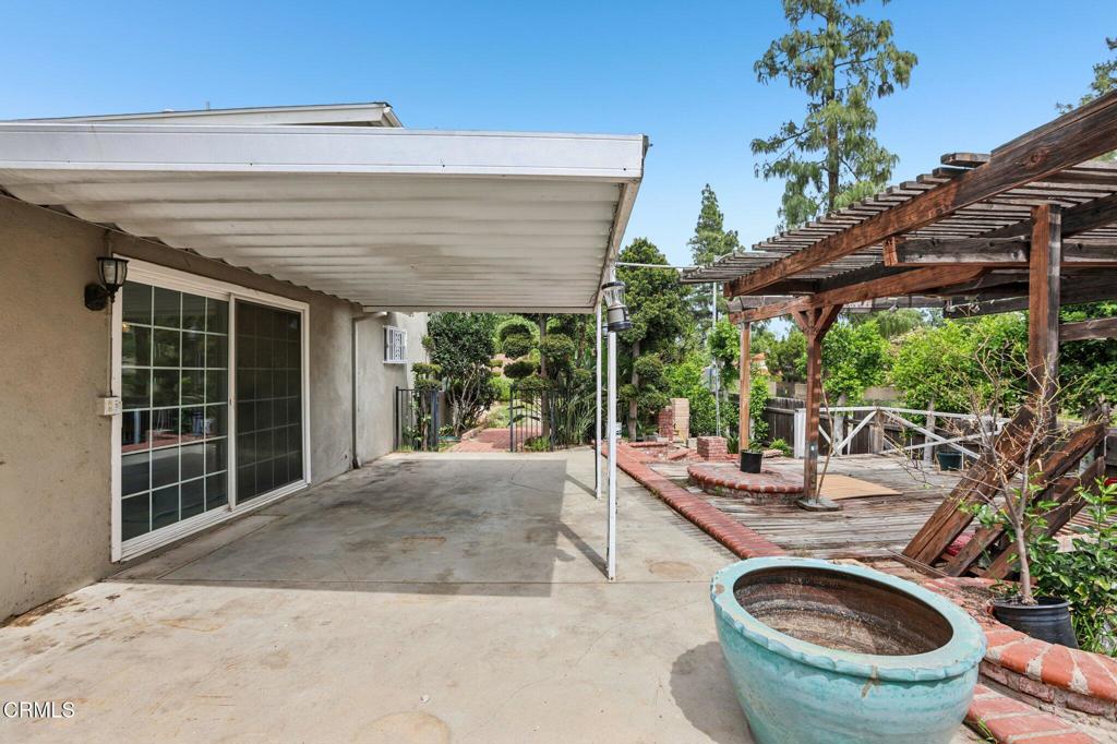 10856 Topeka Drive Porter Ranch, CA 91326 - Photo 33 of 39 a view of a house with sitting area and garden