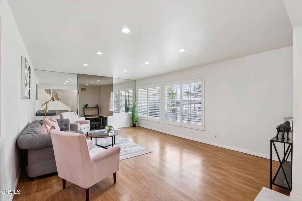 10856 Topeka Drive Porter Ranch, CA 91326 - Photo 6 of 39 a living room with furniture and a wooden floor