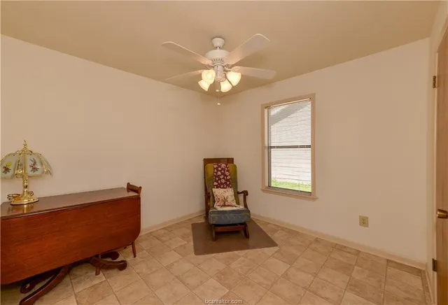 a living room with furniture and window