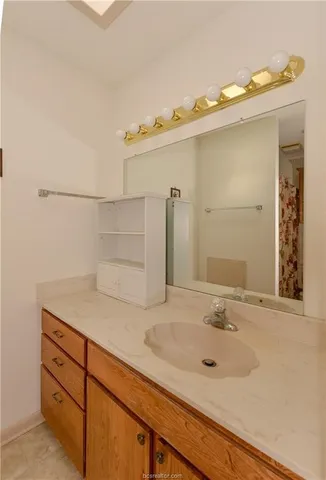a bathroom with a sink and a mirror