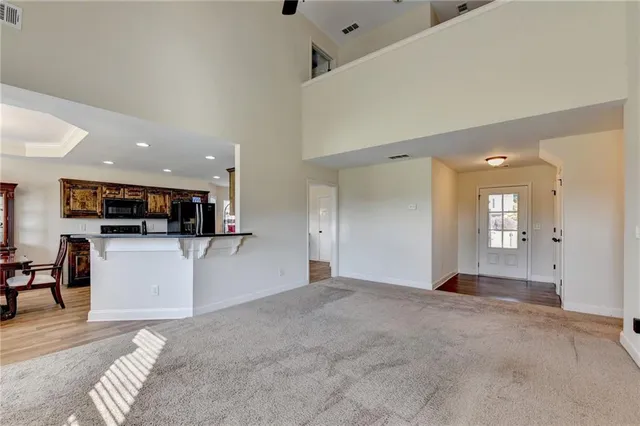 a view of a big room with kitchen view and a window