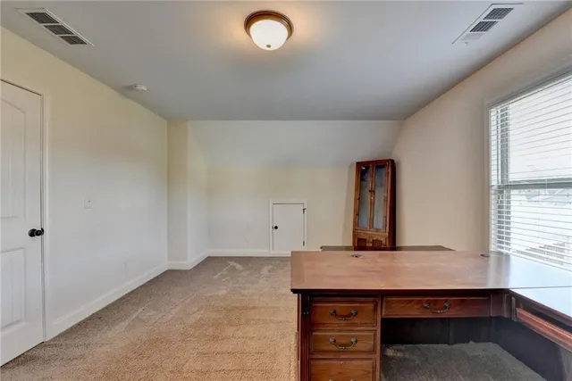 a view of a livingroom with furniture and a ceiling fan