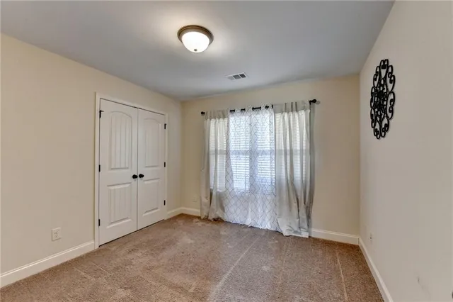 a view of a lake with a table and chairs