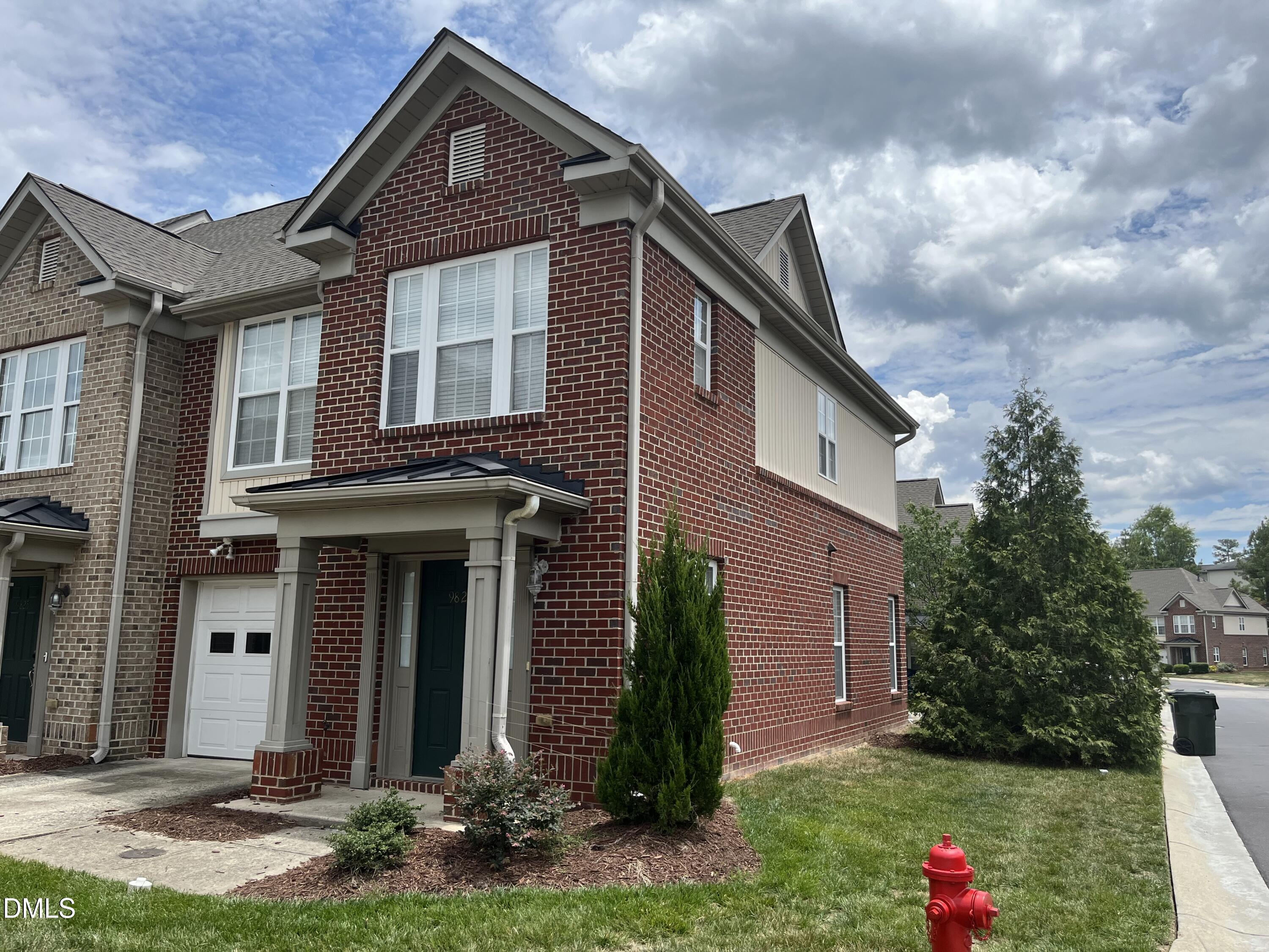 9827 Grettle Court Raleigh, NC 27617 - Photo 2 of 10 a front view of a house with garden