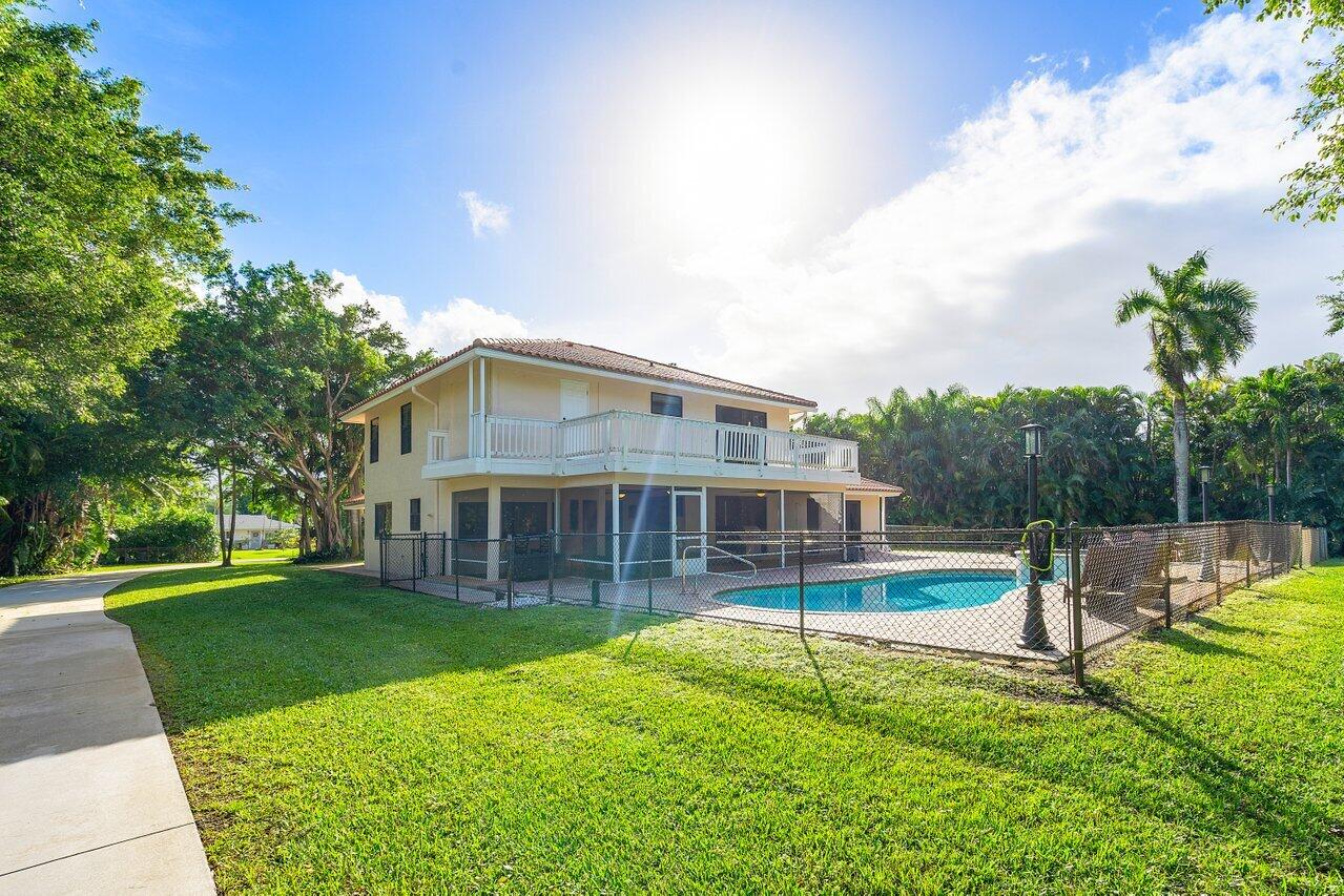5515 Colbright Road Lake Worth, FL 33467 - Photo 51 of 58 back of the home from driveway