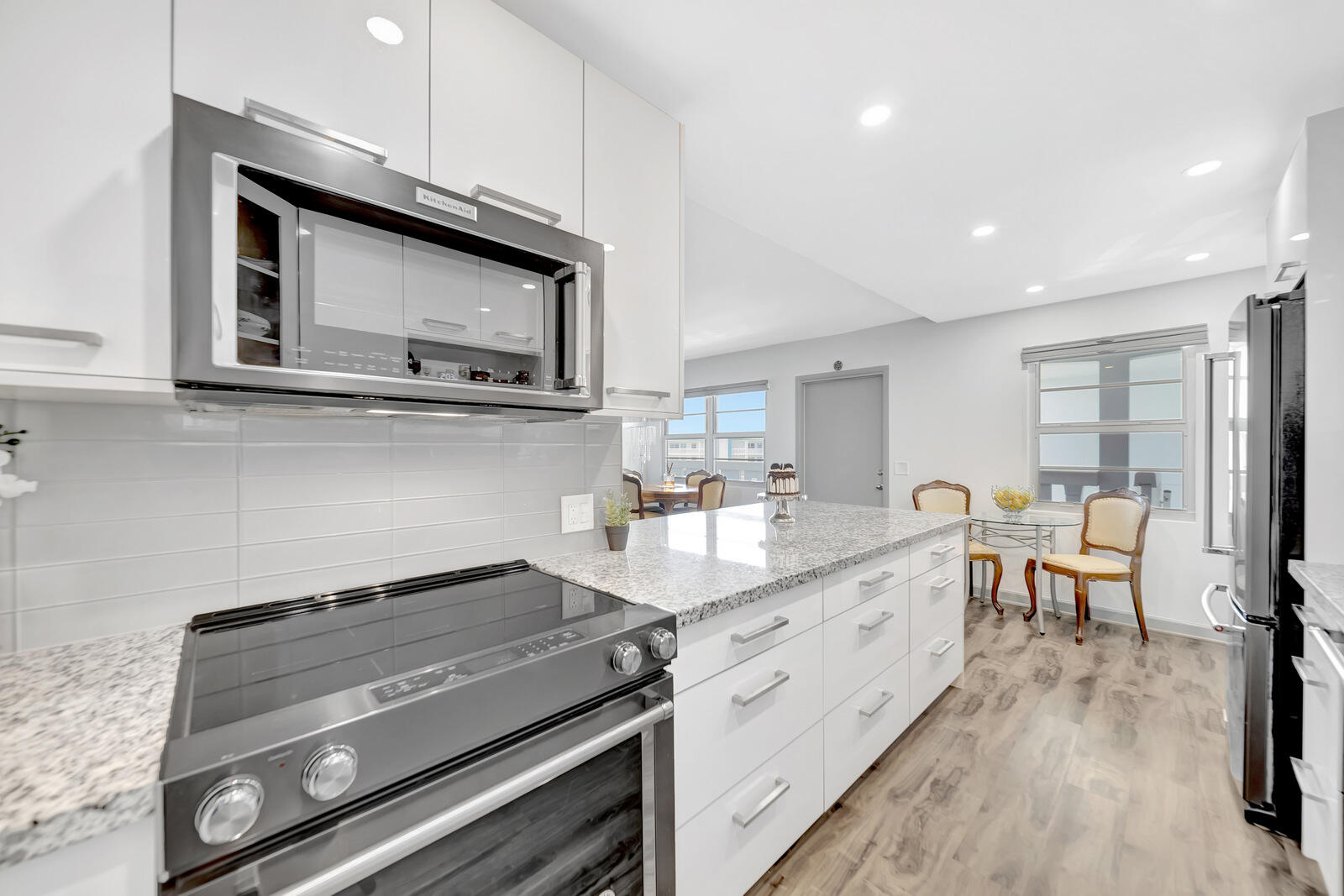 4063 Exeter Boca Raton, FL 33434 - Photo 9 of 55 a kitchen with a stove and a microwave